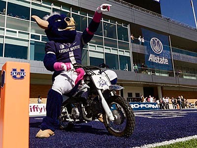 Utah State's Big Blue mascot on a motorcycle at Maverik Stadium