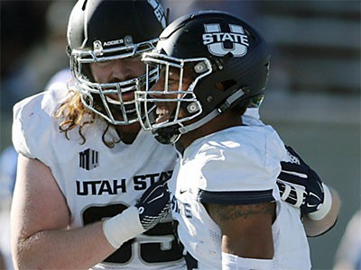 Aggie football players on the field