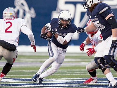 Utate State University football players in action