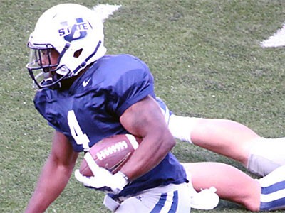 a Utah State football player on the field