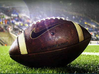 a football on the field at Romney Stadium