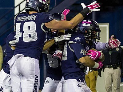 Utah State football players on the field