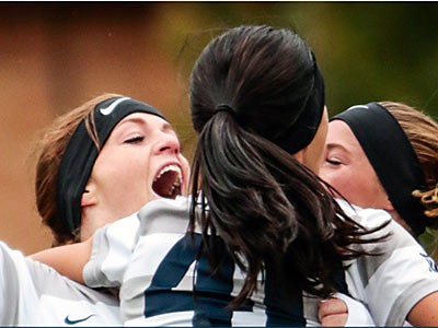 USU soccer players celebrating
