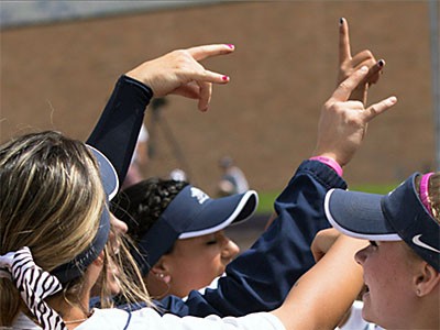 Utah State softball players celebrating
