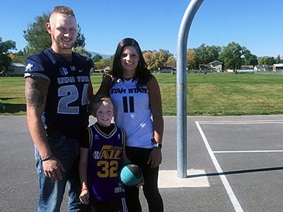 USU athletes Dalton Baker and Lindsey Jensen with Harrison Hardy