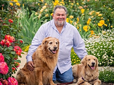 USU Veterinary professor Aubrey H. Fine with dogs