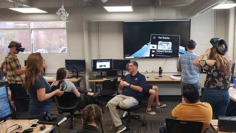 Assistant Professor Ben George (center) with students.