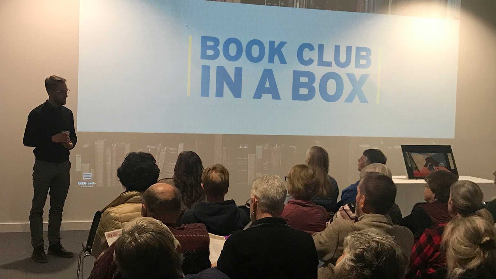 Guest lecturer presents during a 2018 “Book Club in a Box” event.
