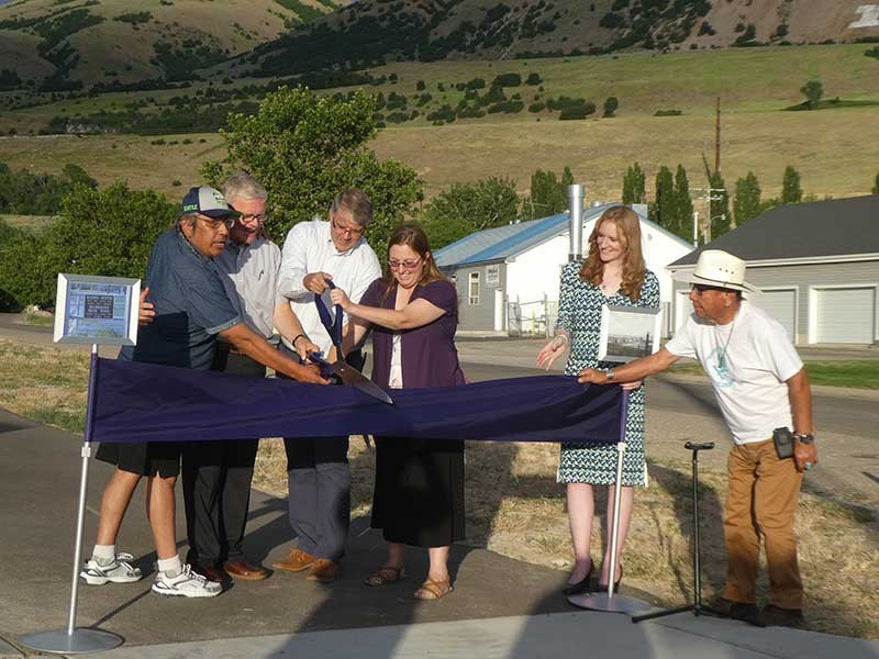 people gathered around for ribbon cutting