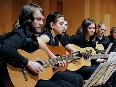 students performing in a USU Guiltar Ensemble
