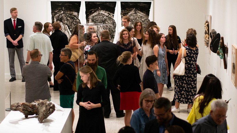 Patrons view exhibits at the Nora Eccles Harrison Museum of Art at Utah State University.