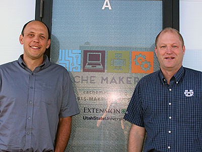 USU alums Joel Duffin and Kevin Reeve receive a award for establishing Cache Makers