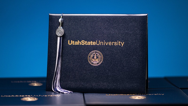 USU diploma cover and tassel.
