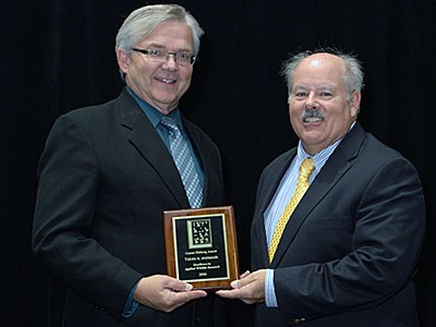 USU Extension specialist Terry messmer recieving the Caesar Kleberg Award