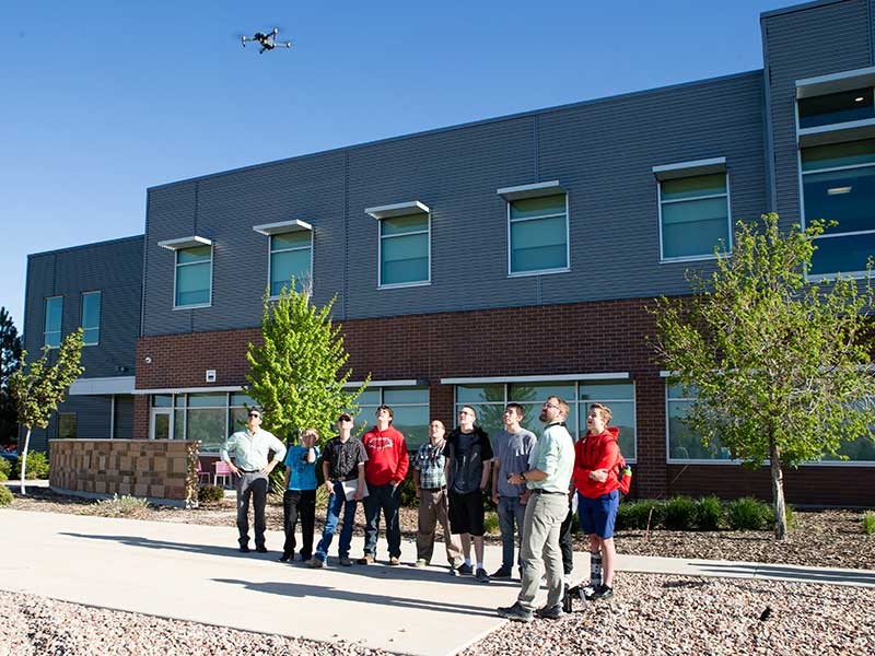 students flying drone