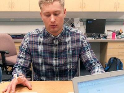 USU student researcher Zach Skabelund working in the Sensory Motor Behavior Lab