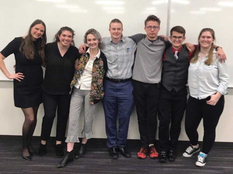 USU students stand with their advisor, USU philosophy post-doctoral fellow Rachel Robison-Greene.