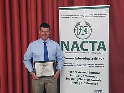 USU agricultural education professor Michael Pate with his educator award