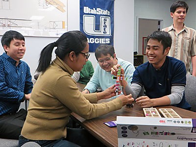 Phranakhon Rajabht University faculty and administrators visit a student lab and office at USU