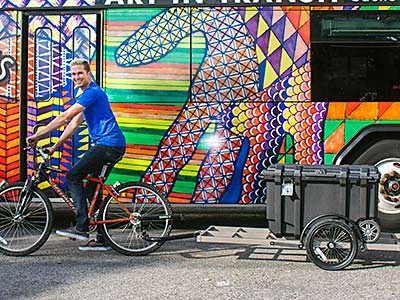 a rider with the USU Food Recovery Bicycle