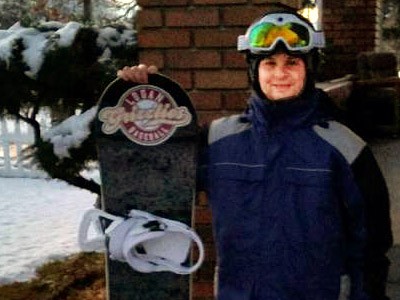 USU Marketplace employee Carson Geiger with his snowboard