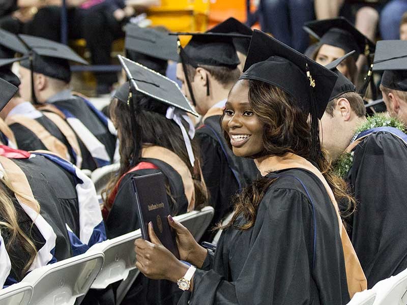 student in graduation cap and gown