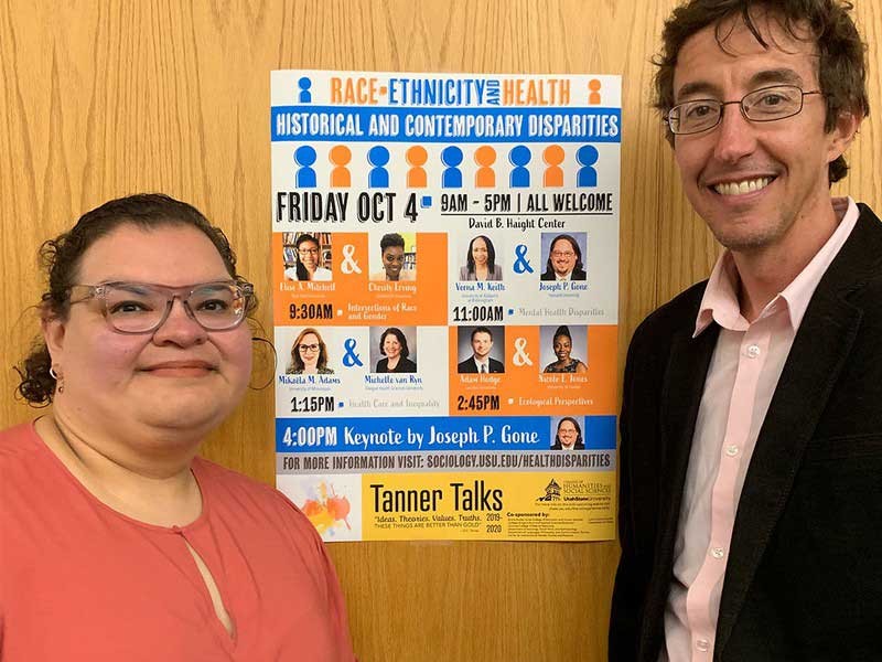 Guadalupe Marquez-Velarde and Seth Archer with poster about their day-long seminar.