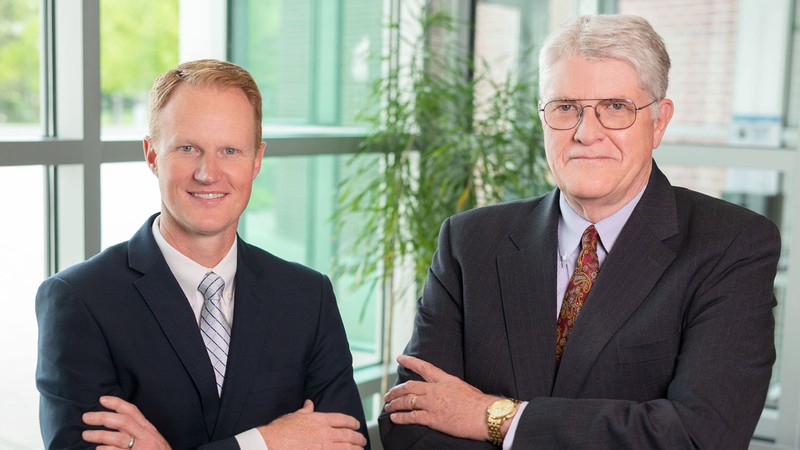 Jed Hancock (left) with SDL President H. Scott Hinton (right).