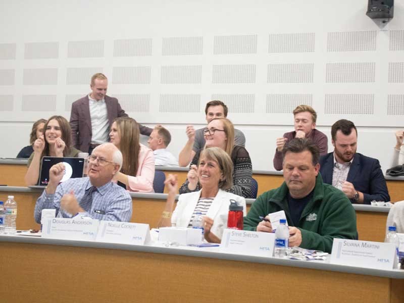 USU President Noelle Cockett with other judges at the competition