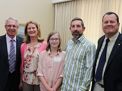 Professor Kelly Kopp with family and USU administrators at her Inaugural Professor Lecture event