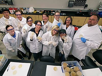 Lianna Etchberger and students in a lab