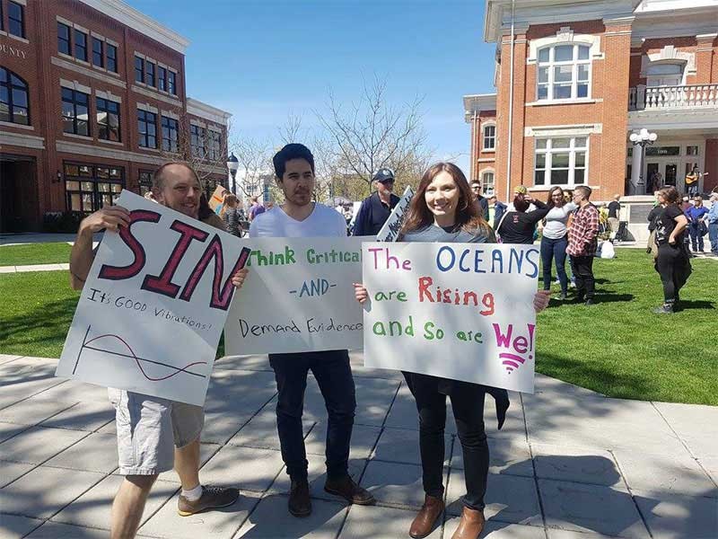 USU students with LGBQT+ posters