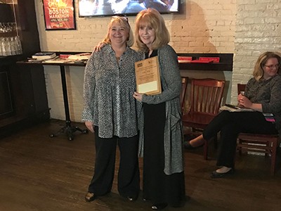 Linda Alsop poses with her award