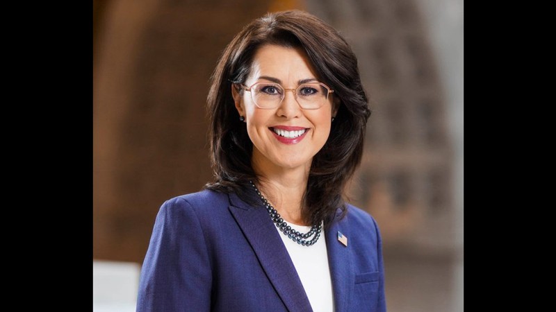 A woman poses for a headshot.