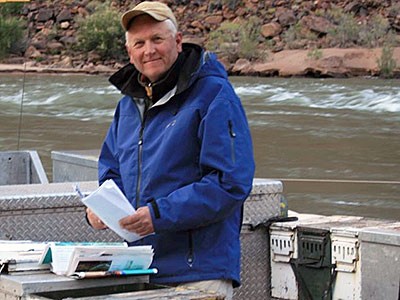 USU professor and researcher Jack Schmidt doing fieldwork research on a river