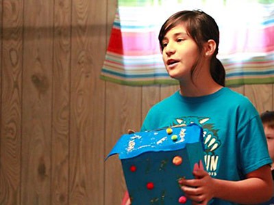 Angie from the Middle School team plays the role of Pandora