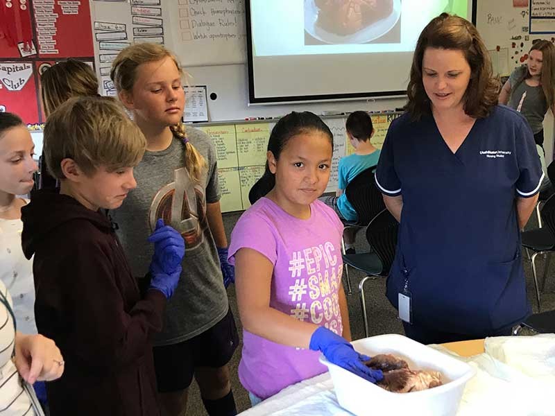Nursing student Kelly Zunich teaching fifth graders