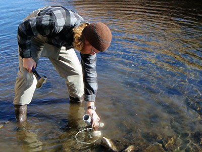 USU acquatic ecology grad student Nate Mouzon collecting river data