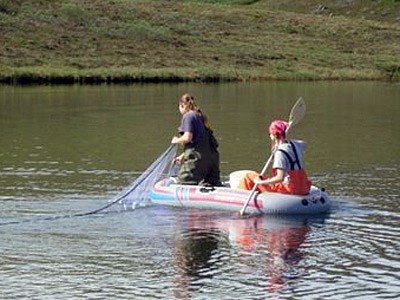 USU student reseachers in a raft