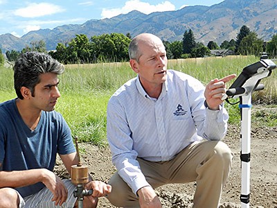Morteza Sadeghi and Scott B. Jones doing measurement and sampling fieldwork