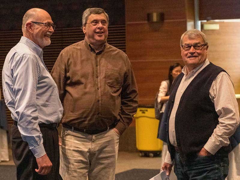 Norman Jones chats with l history professors Len Rosenband and Ross Peterson