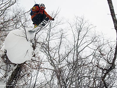 A snowboarder jumping