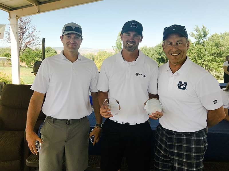 Tyler Rasmussen and Lane Earl, with USU’s Bob Peterson