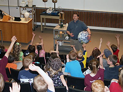 a USU Physics Demonstration lecture and audience members