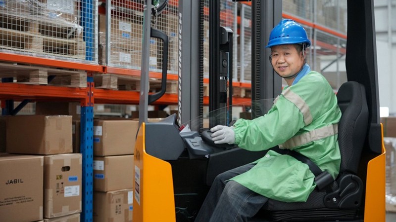 A person operating a forklift.