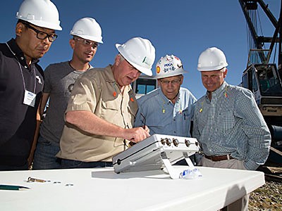 Paul Barr and Joe Caliendo and engineers at conference