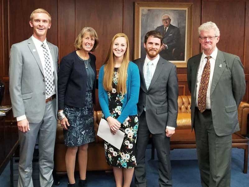 Erin Brann with Michael Scott Peters, President Noelle Cockett, and Jody Burnett