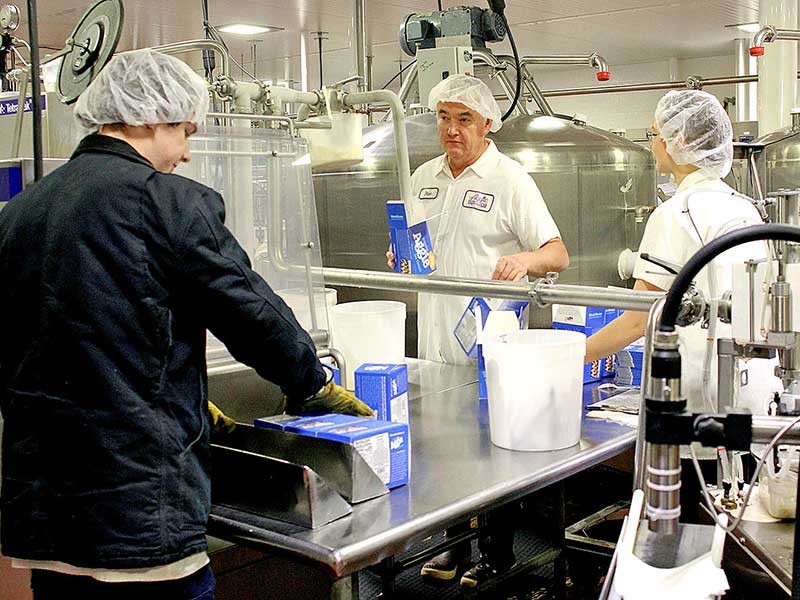Aggie Creamery employees prepare Aggie Ice Cream for distribution