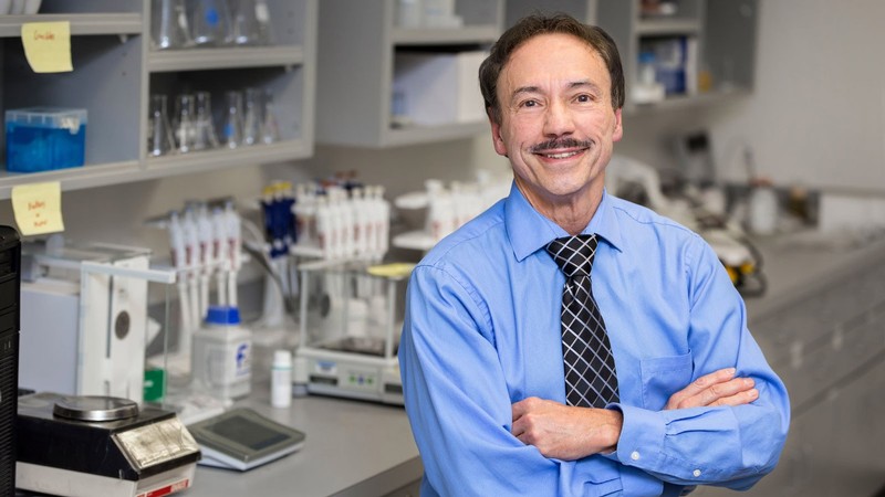 Ron Sims poses for a photo in an engineering lab at Utah State Unversity