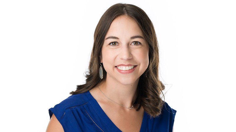 A woman poses for a headshot.